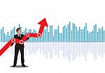 Young Businessman Holding Arrow Going Up. Successful Businessman With Growth Graph Stock Photo