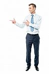 Young Businessman Pointing Copyspace Stock Photo