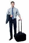 Young Businessman Posing With Trolley Bag Stock Photo