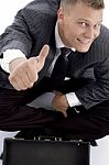 Young Businessman showing Thumb Up Stock Photo