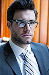 Young Businessman Standing On Office Stock Photo