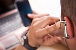 Young Businessman Talking By Phone In The Office Stock Photo