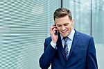 Young Businessman Talking On The Phone Stock Photo