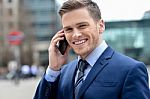 Young Businessman Talking On The Phone Stock Photo