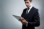 Young Businessman Using Digital Tablet Stock Photo