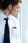 Young Businessman Using His Mobile Phone In Office Stock Photo