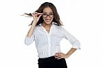Young Businesswoman Adjusting Her Spectacles Stock Photo