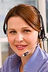 Young Businesswoman With Headset Stock Photo