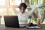 Young Businesswoman Working In Coffee Shop Stock Photo