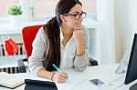 Young Businesswoman Working In Her Office With Laptop Stock Photo