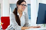 Young Businesswoman Working In Her Office With Laptop Stock Photo