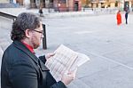 Young Bussiness Man Reading The Newspaper Stock Photo