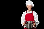 Young Chef Holding Empty Vessels In Hands Stock Photo