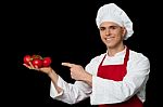 Young Chef Holding Fresh Tomatoes Stock Photo