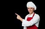 Young Chef Pointing Towards Something Stock Photo