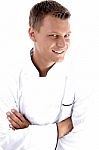 Young Chef Posing With His Arms Crossed Stock Photo