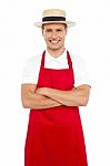 Young Chef Wearing Straw Hat Stock Photo