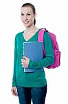 Young College Girl With Backpack And Notebook Stock Photo