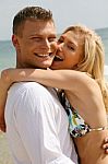 Young Couple At Beach Stock Photo