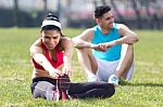 Young Couple Doing Stretching Stock Photo