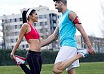 Young Couple Doing Stretching Stock Photo