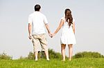 Young Couple Holding Hands Stock Photo