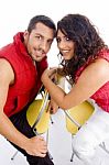 Young Couple Sitting On Chair Stock Photo