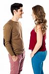 Young Couple Standing Face To Face Stock Photo