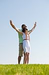 Young Couple Stretching Hands Stock Photo