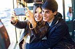 Young Couple Taking Selfies With Smartphone At Bus Stock Photo