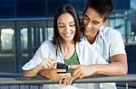 Young Couple With Smart Phone Stock Photo