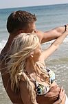 Young Couples At Beach Stock Photo