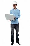 Young Engineer With Laptop Stock Photo