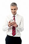 Young Executive Using Mobile Phone Stock Photo