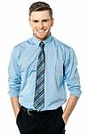 Young Executive With Hands In Pocket Stock Photo