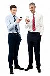 Young Executives Using Mobile Phone Stock Photo