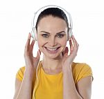 Young Female Enjoying Music Stock Photo