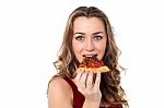 Young Female Having Yummy Pizza Slice Stock Photo