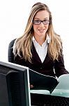 Young Female Sitting In Office Stock Photo