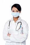 Young Female Surgeon Wearing Face Mask Stock Photo