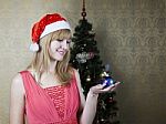 Young Girl Holding A Christmas Toy Stock Photo