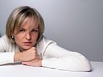 Young Girl Lying On Table Stock Photo