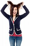 Young Girl Pulling Her Hair In Excitement Stock Photo