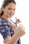 Young Girl Showing Thumb Up With Both Hands Stock Photo