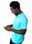 Young Guy Busy Messaging Stock Photo