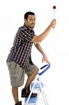 Young Guy Holding Rolling Brush Stock Photo