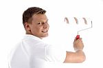 Young Guy Holding Rolling Brush Stock Photo