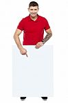 Young Guy Pointing Blank Board Stock Photo