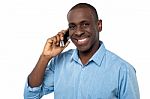 Young Handsome Guy Attending A Phone Call Stock Photo