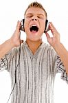 Young Handsome Man Enjoying Music With Headphones Stock Photo